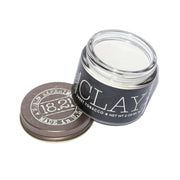 18.21 Man Made front jar view shows packaging and compact travel-ready size