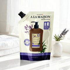 A LA MAISON pouch being poured into dispenser for easy refills