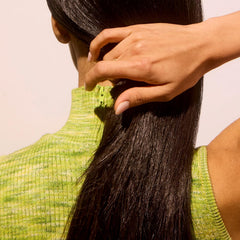 Creamy shampoo lather texture demonstrating Acure cleansing power without weight