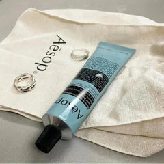 Aesop application on hands demonstrating quick absorption and softening