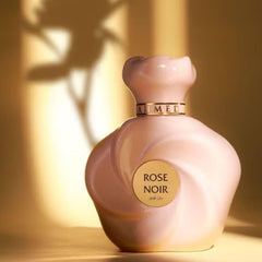 Ahmed Al Maghribi perfume being spritzed on wrist in evening setting, suggests long-lasting allure
