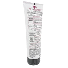 Alcôve tube held in hand for size reference and travel-friendly convenience