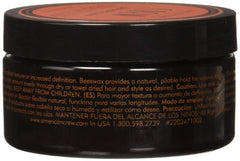 AMERICAN CREW close-up of paste texture on fingers demonstrating easy spreadability and matte finish
