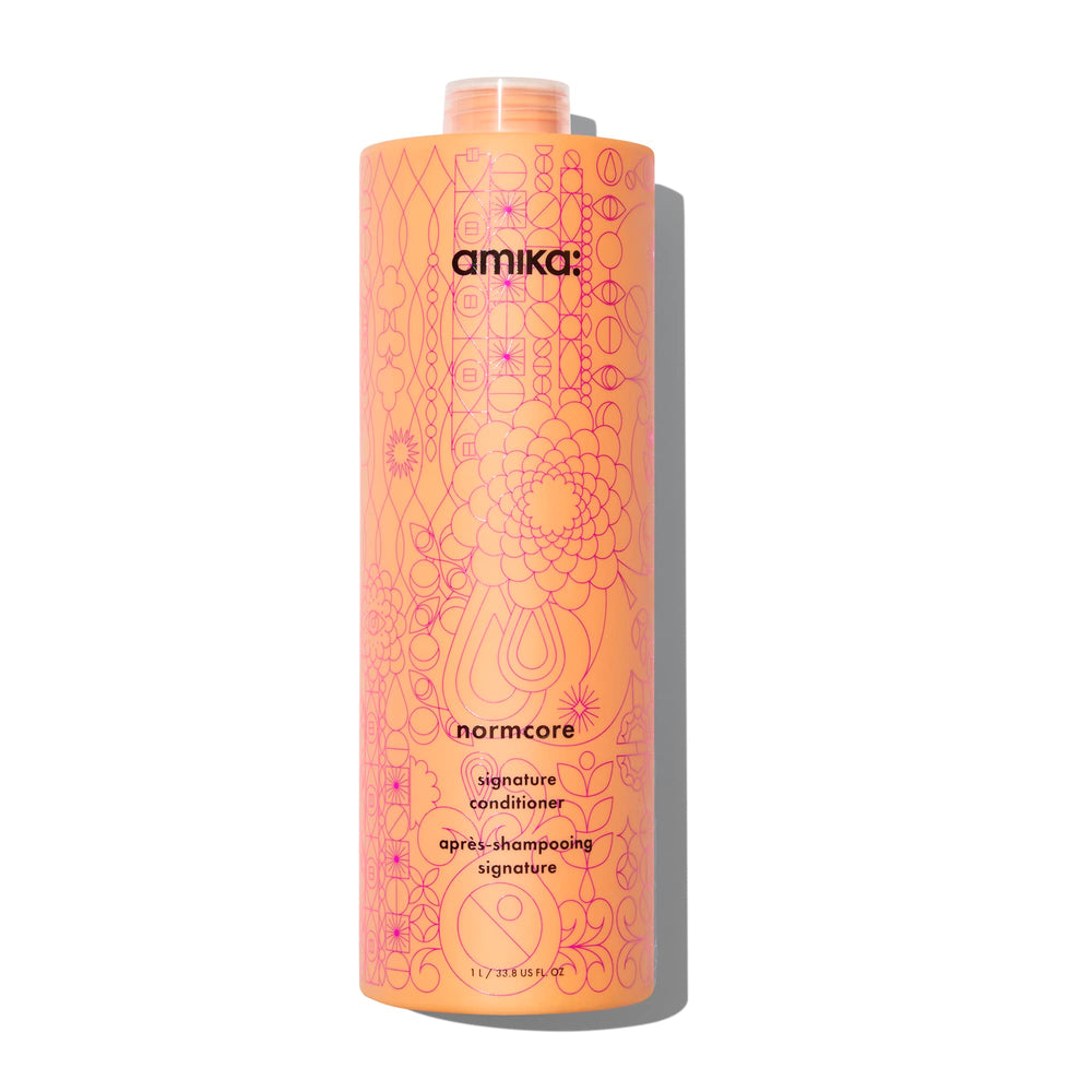 Amika Normcore 1000ml front pump bottle showing convenient dispenser and size benefit