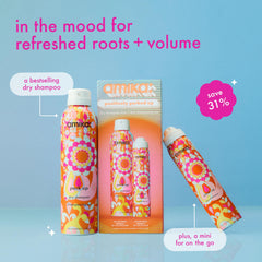 amika full-size dry shampoo close-up highlighting spray nozzle and label benefit