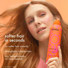 Amika Soulstruck aerosol spray in use dispersing lightweight conditioning mist