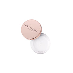 Anastasia Beverly Hills applicator scoop depositing clear wax for precise use