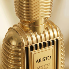 ARABIYAT PRESTIGE bottle in hand indicating portable 3.4 oz convenience