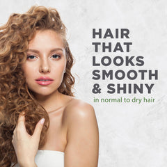 Avalon Organics conditioner dispensed in hand demonstrating smooth application benefit