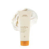 Aveda bottle front view showing branding and size, highlights nourishing formula