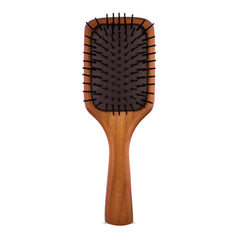 Aveda mini paddle brush front view showing compact design and paddle shape for travel convenience