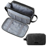 BAGSMART toiletry bag front view showing sleek black canvas and zippered compartments for easy travel