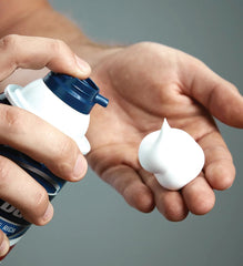 Barbasol can in hand showing size and value for frequent shavers