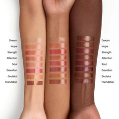 bareMinerals Affection applied on lips in lifestyle shot for natural dewy color boost