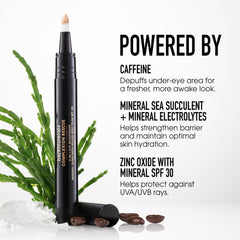 bareMinerals pen held in hand for scale, travel-friendly size for on-the-go touchups
