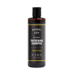 Barrel & Oak front bottle showing coffee and citrus branding and benefit of thicker-looking hair