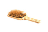 Bass Green Brush front view showing paddle and bamboo pins for gentle detangling