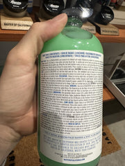 Baxter of California bottle near aloe leaf and eucalyptus showing natural extracts