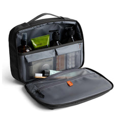 Bellroy opened clamshell interior showing organized pockets for quick visibility and packing