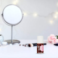 Benefit Benetint in a purse lifestyle shot demonstrating portable size and on-the-go convenience