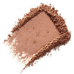 Close-up texture of Benefit Hoola powder highlighting soft, blendable surface for even color benefit