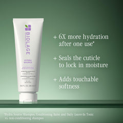 Biolage pouring onto hair strand for easy application and slip