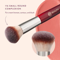 BK BEAUTY brush held in hand showing compact size for travel