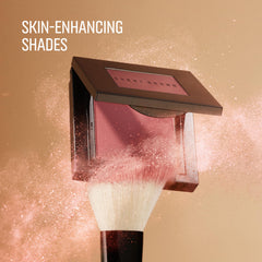 Bobbi Brown applying blush with brush on cheek showcasing easy blending benefit: natural-looking flush