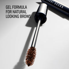 Bobbi Brown Brow Shaper held in hand for size reference and travel-friendly convenience benefit