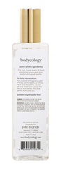 Bodycology bottle placed in a handbag for portability and on-the-go scent refresh