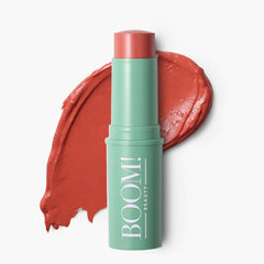 BOOM! by Cindy Joseph front packaging showing warm coral-peach shade and travel-friendly design