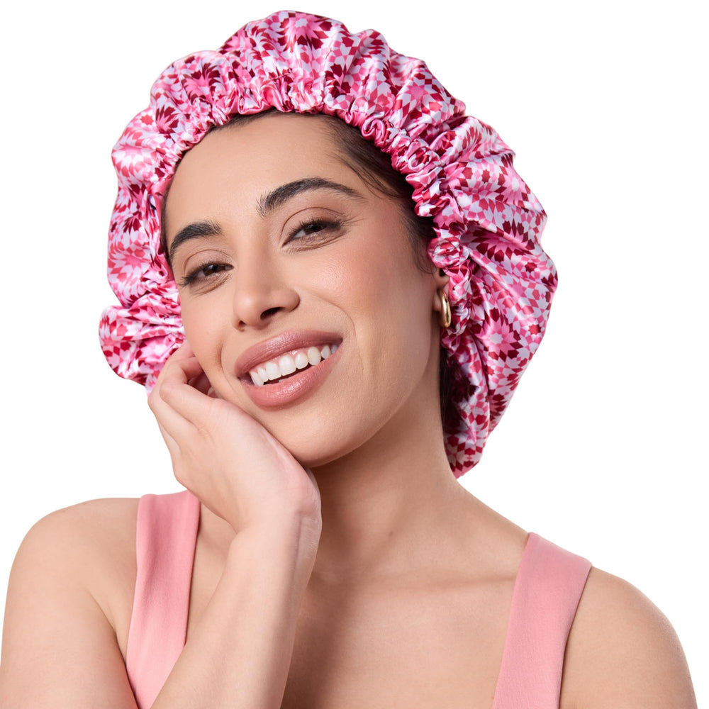 Bounce Curl front view of pink satin bonnet showing full coverage and protective fit