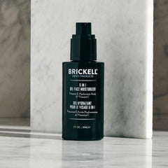 Brickell Men's applying gel after shaving to jawline demonstrating soothing, non-greasy benefit