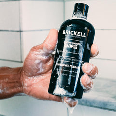 Brickell bottle label close-up highlighting 1.8% salicylic acid active ingredient
