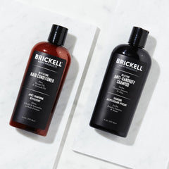 Brickell conditioner pouring to reveal creamy consistency that moisturizes hair