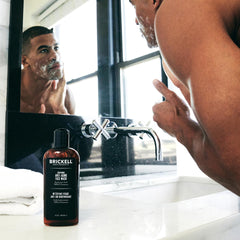 Brickell Men’s gel texture drop on fingertip showing hydration and lightweight lather benefit