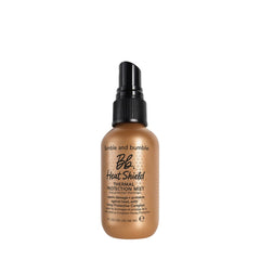 Bumble and bumble front packaging of Heat Shield mini protecting hair while traveling