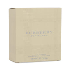 Burberry bottle on dresser styled with accessories showing everyday luxury