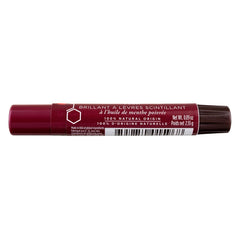 Burt's Bees lip shimmer plum held in hand to show compact size and portability