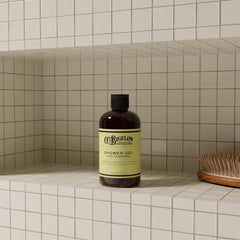 C. O. Bigelow shower gel in use in shower offering an invigorating experience
