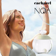 Cacharel Noa next to ruler showing 3.4 oz scale for practical size reference