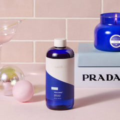 Capri Blue bottle pouring bubble bath showing easy application benefit