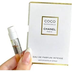 CHANEL Coco Mademoiselle Intense lifestyle shot in a purse for travel convenience and elegant on-the-go fragrance