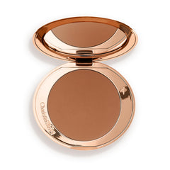 Charlotte Tilbury compact front view showing sleek refillable design and benefit of portability