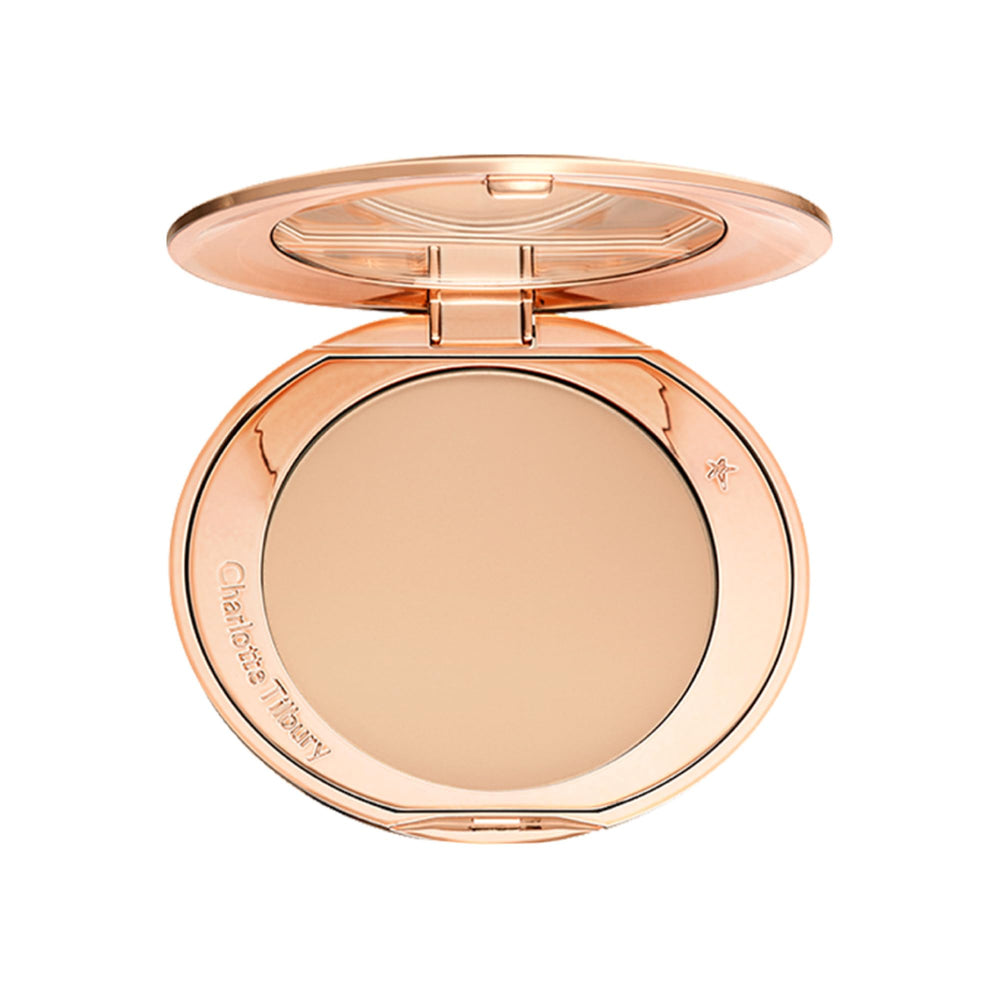 Charlotte Tilbury compact front view showing elegant packaging and premium finish benefit
