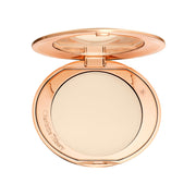 Charlotte Tilbury compact front view showing sleek design and portability