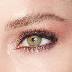 Charlotte Tilbury fingertip applying Oyster Pearl demonstrating quick swipe-and-go radiance