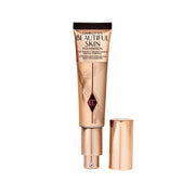 Charlotte Tilbury bottle front view showing elegant packaging and glow benefits