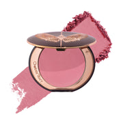 Charlotte Tilbury front packaging view showing elegant compact and branding benefit of travel-ready design