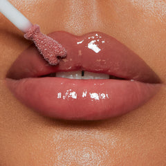 Charlotte Tilbury on-model close-up showing smooth, plumped natural lips